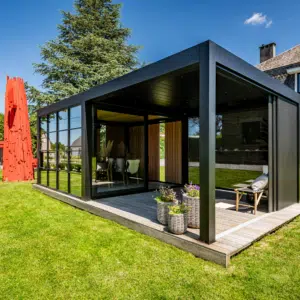 A sophisticated Dual-Zone Space structure featuring a combination of louvred blades and solid roofing, creating a seamless, multi-functional garden living area.