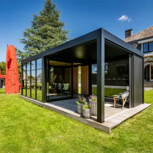 A sophisticated Dual-Zone Space structure featuring a combination of louvred blades and solid roofing, creating a seamless, multi-functional garden living area.