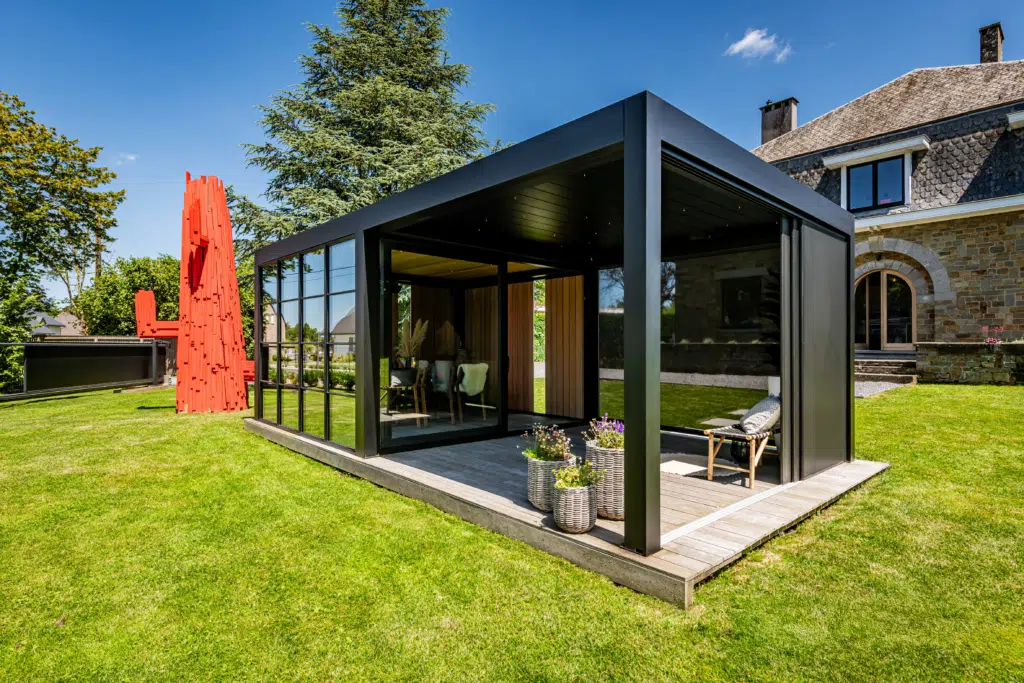 A sophisticated Dual-Zone Space structure featuring a combination of louvred blades and solid roofing, creating a seamless, multi-functional garden living area.