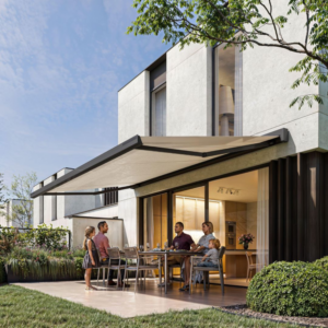 A sleek, modern solar-powered awning extended over a garden seating area, featuring an integrated solar panel and stylish fabric canopy.