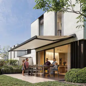 A sleek, modern solar-powered awning extended over a garden seating area, featuring an integrated solar panel and stylish fabric canopy.