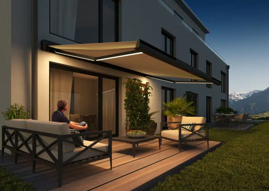 A sleek, modern solar-powered awning extended over a garden seating area, featuring an integrated solar panel and stylish fabric canopy.