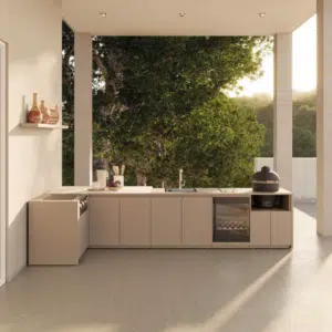 Premium L-shaped outdoor kitchen featuring high-end integrated cooking appliances, extensive preparation worktops, and modern weather-proof cabinetry for a luxury garden transformation.
