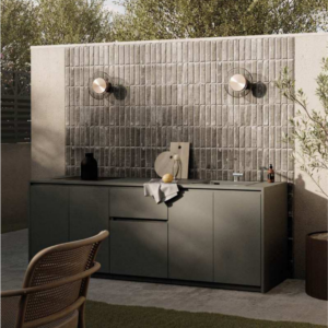 Premium linear outdoor kitchen featuring high-end integrated cooking appliances, streamlined preparation worktops, and modern weather-proof cabinetry for a sleek garden transformation.