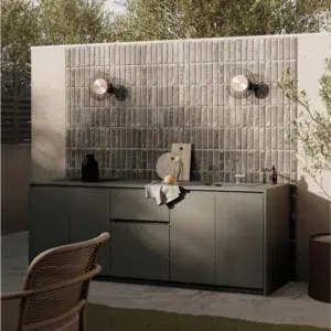 Premium linear outdoor kitchen featuring high-end integrated cooking appliances, streamlined preparation worktops, and modern weather-proof cabinetry for a sleek garden transformation.