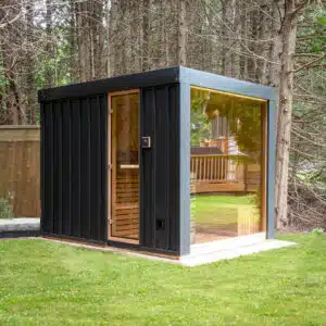 Premium Outdoor Neptune Sauna featuring a modern panoramic window view, designed for a luxury garden wellness installation.
