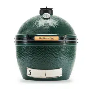 A professional e-commerce product shot of the official Big Green Egg XL Integrated Nest Handler, showcasing the heavy-duty black powder-coated steel rolling base with its thick, curved handling bars cradling the Extra Large EGG.