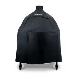 A professional e-commerce product shot of the durable Big Green Egg Cover A, tailored to fit an XL or Large EGG housed in a Modular Nest system, featuring heavy-duty black fabric and the signature logo.