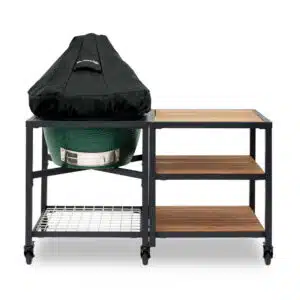 A professional e-commerce product shot of the durable Big Green Egg Cover F, showcasing its heavy-duty, weather-resistant black fabric with the signature green Big Green Egg logo.