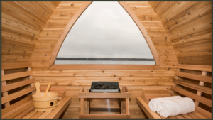 A side-by-side interior viewpoint of two luxury outdoor barrel saunas, one showcasing a rustic wood-burning stone stove filled with logs, and the other featuring a clean, minimalist digital electric heater unit mounted on a timber wall.