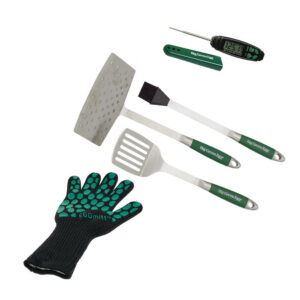 A professional e-commerce product shot of the Essential BBQ Cooking Kit, showcasing a curated selection of heavy-duty grilling tools, including stainless steel tongs, a robust spatula, a silicone basting brush, and a digital meat thermometer arranged neatly.