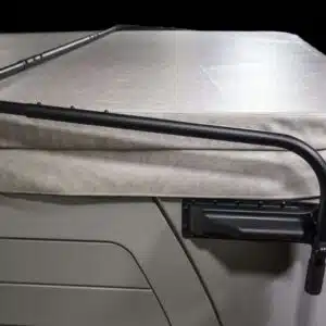 A premium hydraulic hot tub cover lifter mechanism holding an open spa cover securely in place.