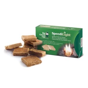 A professional e-commerce product shot of the official Big Green Egg Premium Natural BBQ Firestarters, displaying the box alongside the clean-burning, compressed wood and wax firestarting squares.