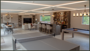 A stunning, fully insulated contemporary garden room with floor-to-ceiling glass doors, set within a beautifully landscaped UK garden with integrated outdoor lighting.