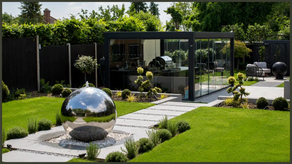 Pergola, outdoor kitchen and garden design in Oakwood, Enfield, creating a stylish outdoor space for cooking, dining and entertaining.